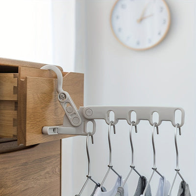 1 gancho plegable para ropa con 5 ganchos ergonómicos - Colgador portátil, ahorrador de espacio y duradero para viajes, hoteles, residencias y uso en interiores, colgadores para ropa, esenciales para dormitorios, diseño multigancho, opciones versátiles d
