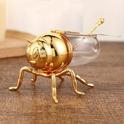 Tarro de Miel con Forma de Abeja Lujoso - Frasco Metálico Dorado y Vidrio con Tapa Articulada y Cuchara, Almacenamiento Decorativo para Miel, Especias, Azúcar, Té - Estilo Vintage para Mesa, 14x9.6x8 cm
