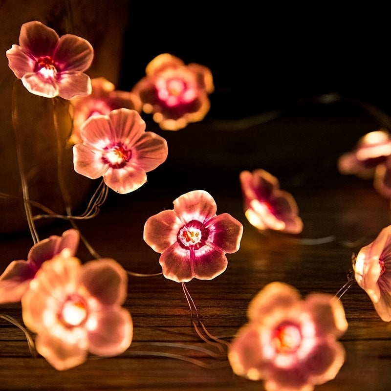 Una cadena de luces en forma de flor de cerezo de 20 luces LED, luces de flores rosadas, cadena de luces decorativas para dormitorio rosa, luces decorativas festivas para dormitorio con un toque femenino, de 2 metros de largo, con 20 luces (baterías no i