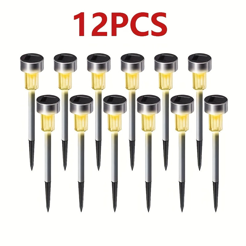 Un conjunto de 12 luces solares de camino con diseño semi enterrado, fabricadas de acero inoxidable para iluminación decorativa al aire libre. Son eficientes en energía y emiten una luz blanca suave/cálida/luz cálida/luz de color, adecuadas para patios,