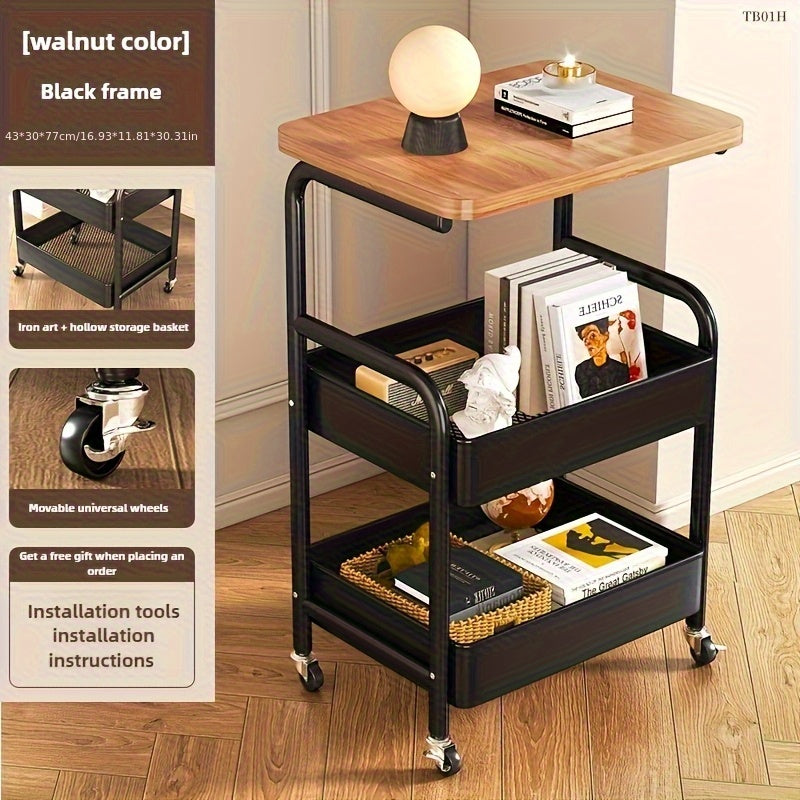 Un carrito de tres niveles con superficie de mesa, herramientas metálicas y estante de almacenamiento para snacks, con un marco de acero al carbono duradero y ruedas portátiles, ideal para uso en casa o en la oficina.