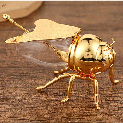 Tarro de Miel con Forma de Abeja Lujoso - Frasco Metálico Dorado y Vidrio con Tapa Articulada y Cuchara, Almacenamiento Decorativo para Miel, Especias, Azúcar, Té - Estilo Vintage para Mesa, 14x9.6x8 cm