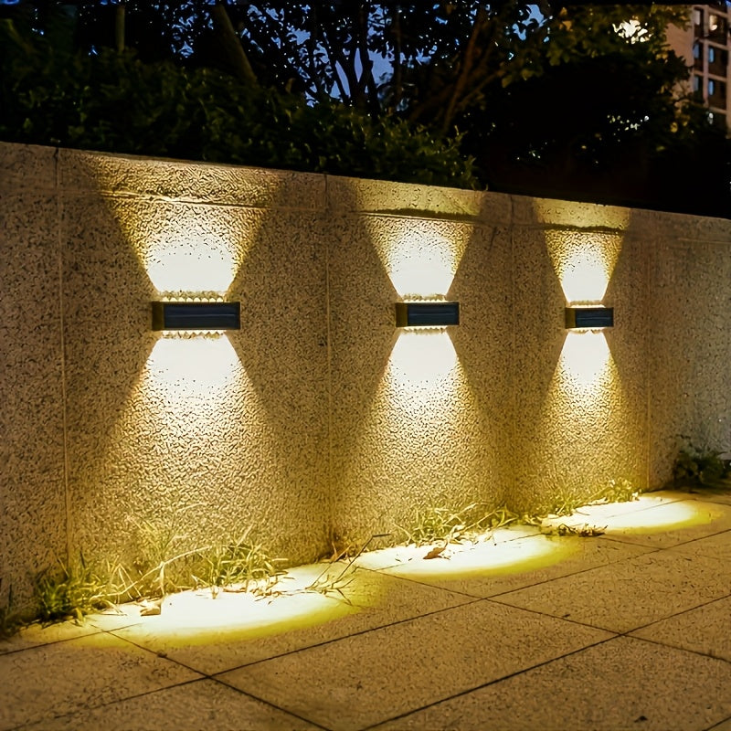 Juego de 2 luces solares para exteriores con 16 LEDs, ideales para mejorar patios y paredes. Estas luces decorativas de paisaje mejoran el ambiente con la capacidad de lavado de paredes en dos direcciones, perfectas para decorar balcones de verano. Clasi