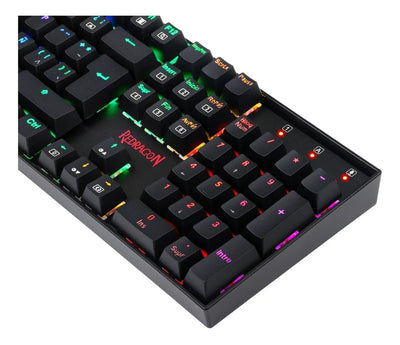 Teclado gamer Redragon Mitra QWERTY Outemu Blue español latinoamérica color negro con luz RGB