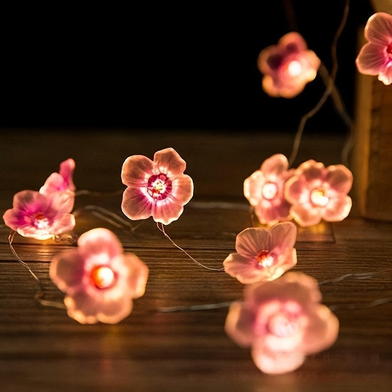 Una cadena de luces en forma de flor de cerezo de 20 luces LED, luces de flores rosadas, cadena de luces decorativas para dormitorio rosa, luces decorativas festivas para dormitorio con un toque femenino, de 2 metros de largo, con 20 luces (baterías no i