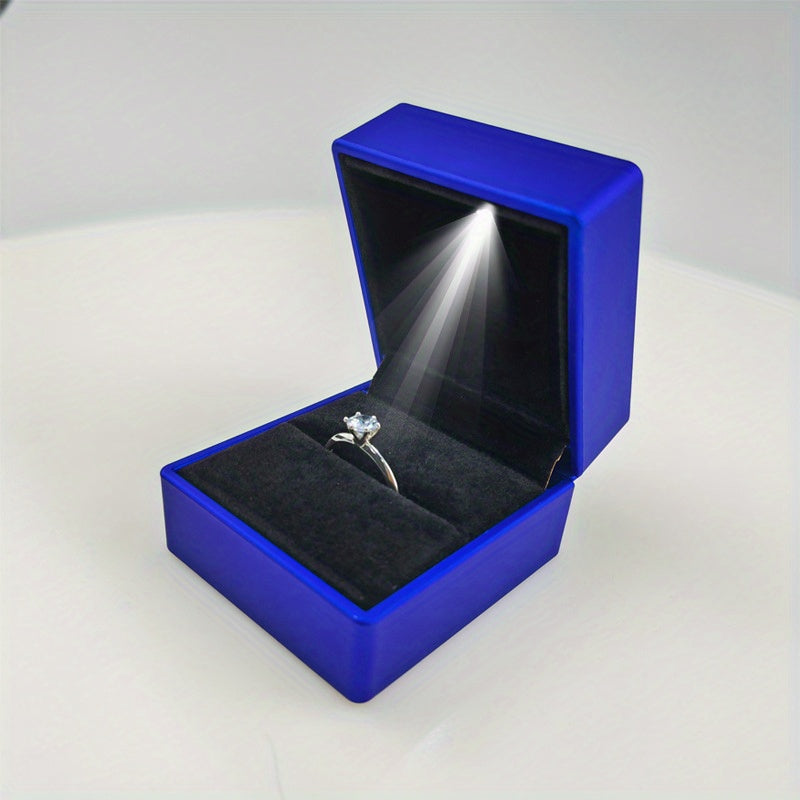 1 caja de anillos moderna con luz LED alimentada por batería, estuche para joyas con brillo suave para alianzas y bodas, 6x5x2 cm, plástico duradero, 4 colores (rojo/azul//gris), iluminación elegante para exhibición de anillos | Estuche decorativo interi
